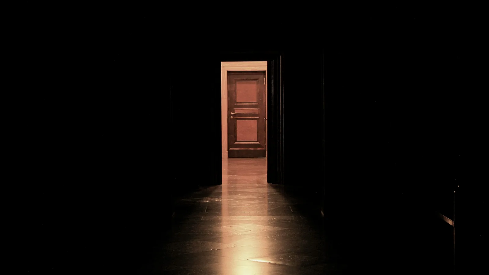 Light passing through a single narrow doorway in a dark room